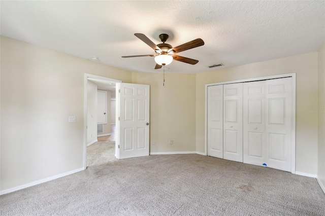 297 Beacon Pointe Dr, Ocoee, FL 34761 - unfurnished bedroom with carpet, a closet, and a ceiling fan