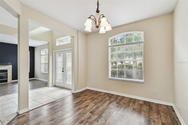 297 Beacon Pointe Dr, Ocoee, FL 34761 - entryway featuring wood finished floors and a chandelier