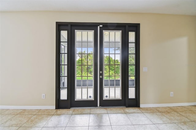 297 Beacon Pointe Dr, Ocoee, FL 34761 - entryway featuring french doors and tile patterned floors