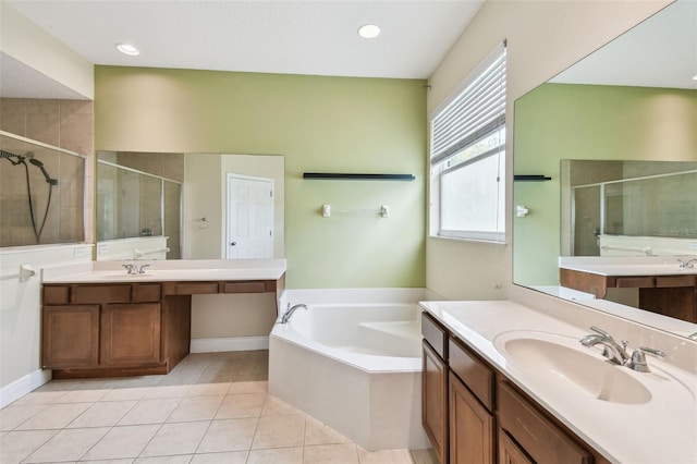 297 Beacon Pointe Dr, Ocoee, FL 34761 - full bath featuring a shower stall, a bath, two vanities, and recessed lighting