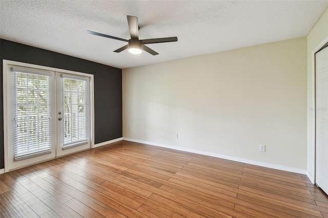 297 Beacon Pointe Dr, Ocoee, FL 34761 - unfurnished room featuring ceiling fan, french doors, a textured ceiling, and light wood finished floors