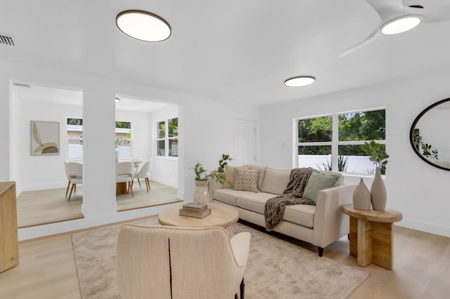 3381 19th Pl SW, Largo, FL 33774 - living room with light wood-type flooring and baseboards