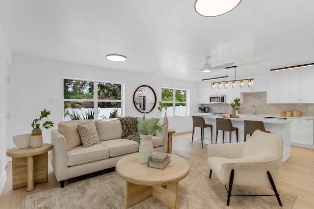 3381 19th Pl SW, Largo, FL 33774 - living room with a ceiling fan and light wood finished floors