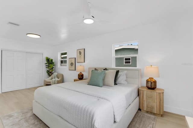 3381 19th Pl SW, Largo, FL 33774 - bedroom with light wood-style flooring and a closet