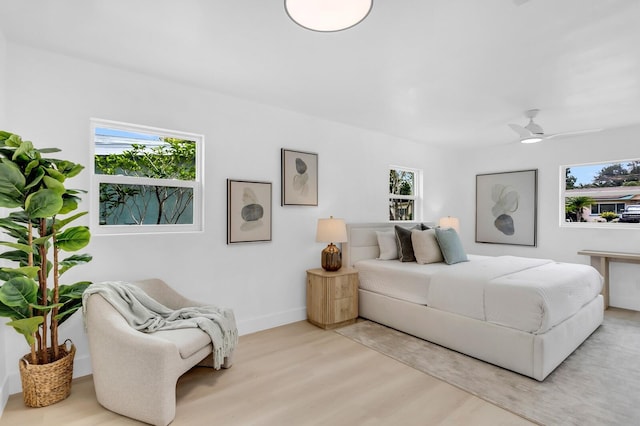 3381 19th Pl SW, Largo, FL 33774 - bedroom with light wood finished floors and baseboards