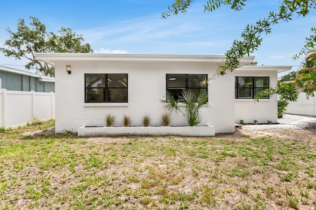 3381 19th Pl SW, Largo, FL 33774 - view of side of home featuring stucco siding