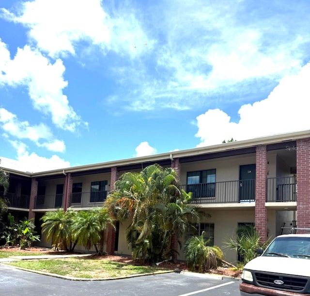 1020 85th Ave N Unit 223, Saint Petersburg, FL 33702 - view of property featuring uncovered parking