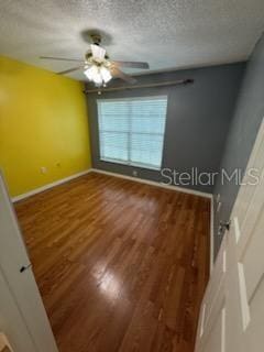 1020 85th Ave N Unit 223, Saint Petersburg, FL 33702 - spare room with wood finished floors, a textured ceiling, and ceiling fan