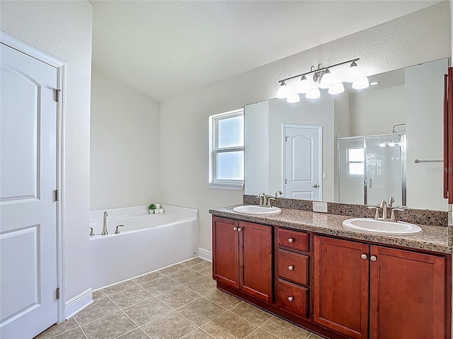 14371 Edinburgh Moor Dr, Wimauma, FL 33598 - bathroom with a garden tub, double vanity, a stall shower, and tile patterned floors