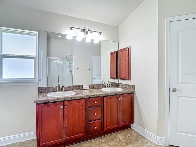 14371 Edinburgh Moor Dr, Wimauma, FL 33598 - bathroom with double vanity, a stall shower, and tile patterned floors