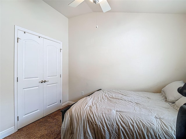 14371 Edinburgh Moor Dr, Wimauma, FL 33598 - carpeted bedroom with vaulted ceiling, a ceiling fan, and a closet