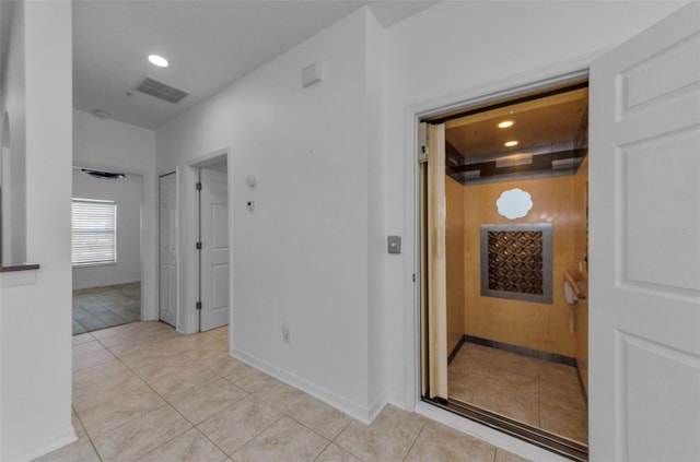5030 Herring Ct, New Port Richey, FL 34652 - hallway featuring light tile patterned flooring and recessed lighting