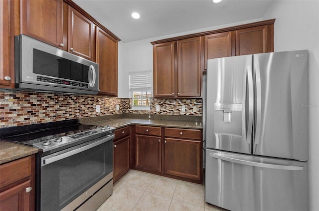 5030 Herring Ct, New Port Richey, FL 34652 - kitchen with appliances with stainless steel finishes, light tile patterned flooring, backsplash, and recessed lighting
