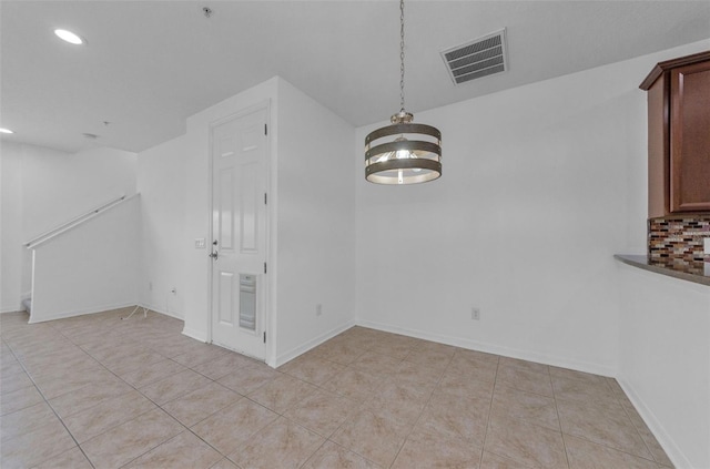 5030 Herring Ct, New Port Richey, FL 34652 - unfurnished dining area with recessed lighting, light tile patterned floors, and a chandelier