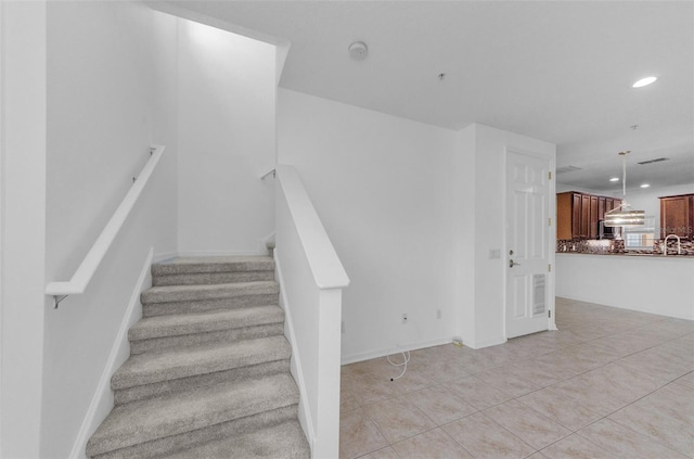 5030 Herring Ct, New Port Richey, FL 34652 - staircase with recessed lighting and tile patterned floors