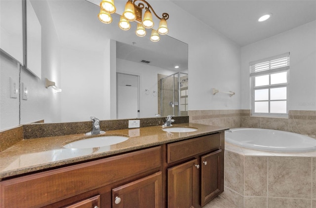5030 Herring Ct, New Port Richey, FL 34652 - bathroom with a stall shower, double vanity, a bath, and recessed lighting