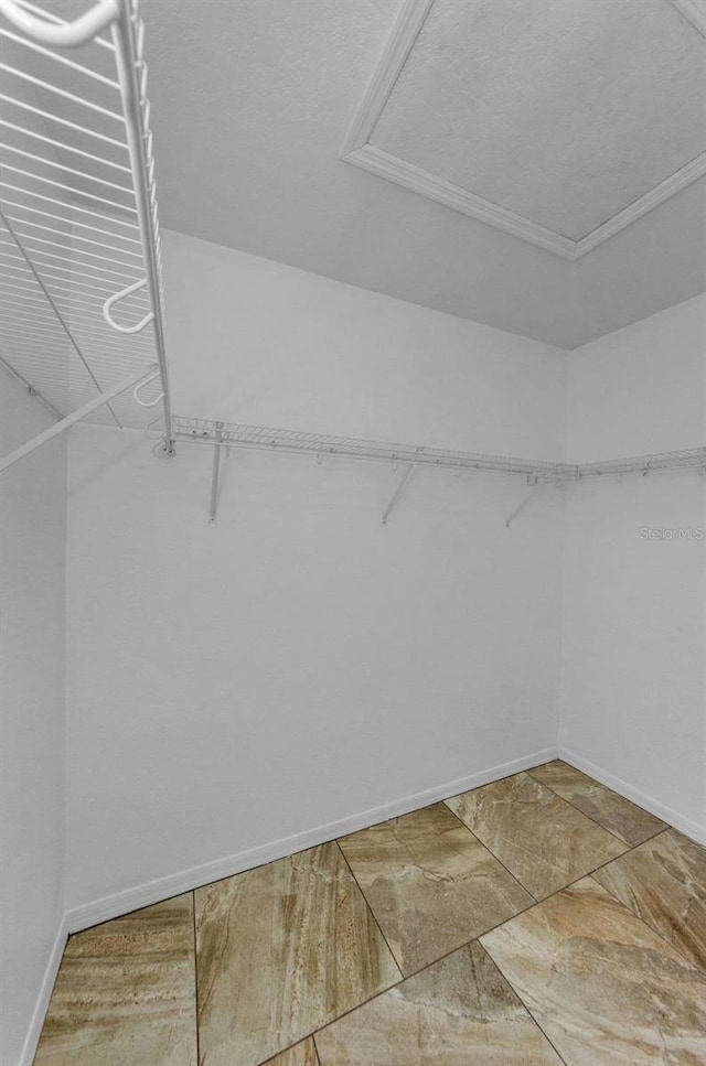 5030 Herring Ct, New Port Richey, FL 34652 - walk in closet with stone finish flooring