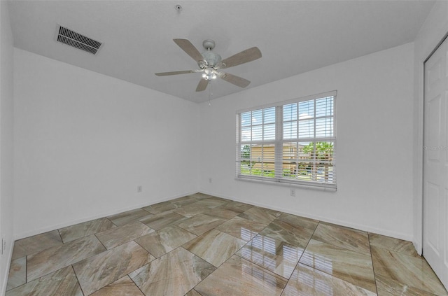 5030 Herring Ct, New Port Richey, FL 34652 - empty room featuring a ceiling fan and baseboards