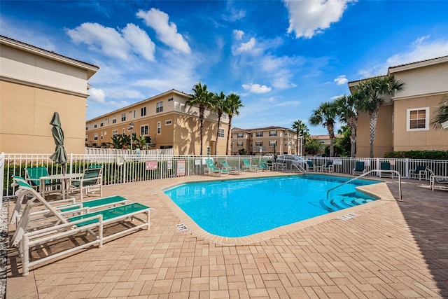 5030 Herring Ct, New Port Richey, FL 34652 - community pool with a patio