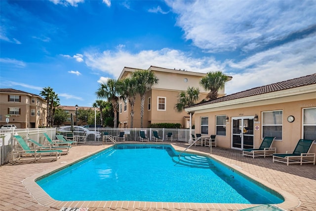 5030 Herring Ct, New Port Richey, FL 34652 - community pool featuring a patio area