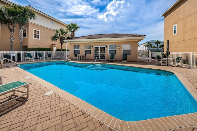5030 Herring Ct, New Port Richey, FL 34652 - community pool with a patio