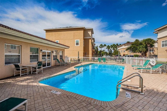 5030 Herring Ct, New Port Richey, FL 34652 - community pool featuring a patio