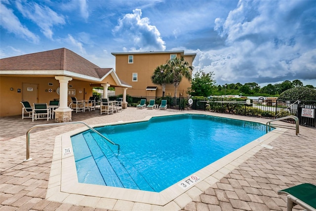 5030 Herring Ct, New Port Richey, FL 34652 - community pool with a patio area