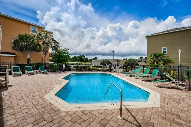 5030 Herring Ct, New Port Richey, FL 34652 - community pool with a patio area