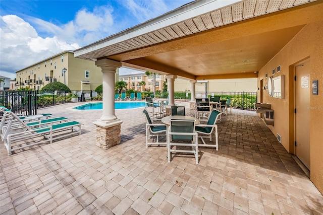 5030 Herring Ct, New Port Richey, FL 34652 - view of patio / terrace featuring a community pool