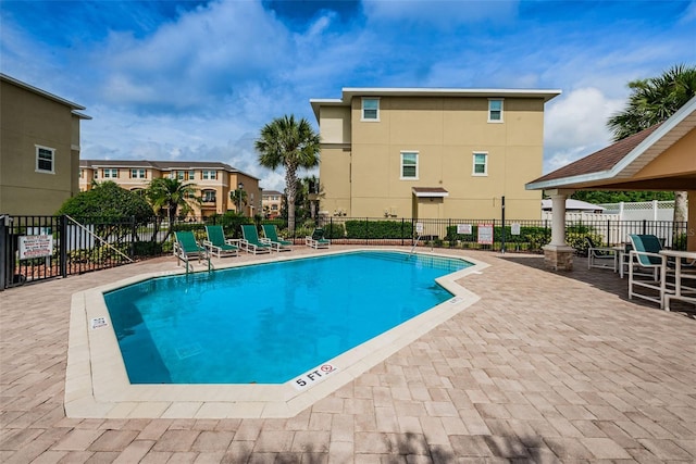 5030 Herring Ct, New Port Richey, FL 34652 - community pool featuring a patio