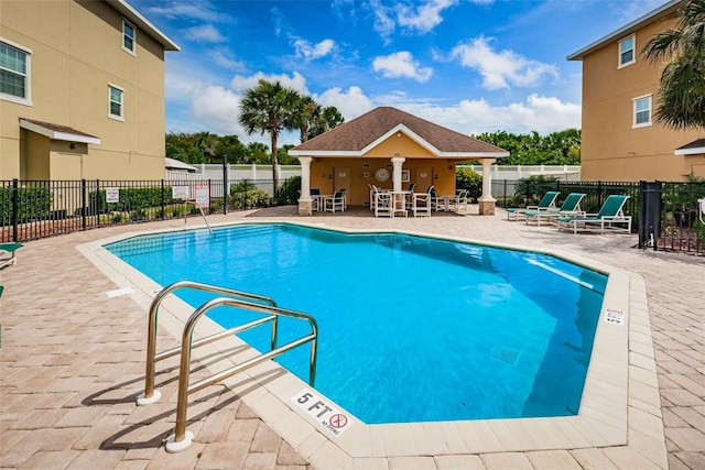 5030 Herring Ct, New Port Richey, FL 34652 - community pool featuring a patio area