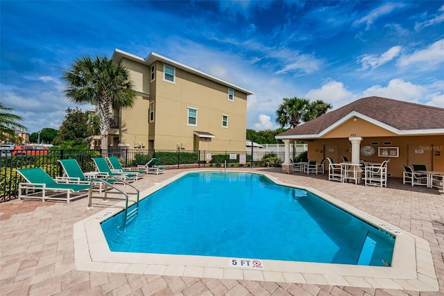 5030 Herring Ct, New Port Richey, FL 34652 - community pool featuring a patio area