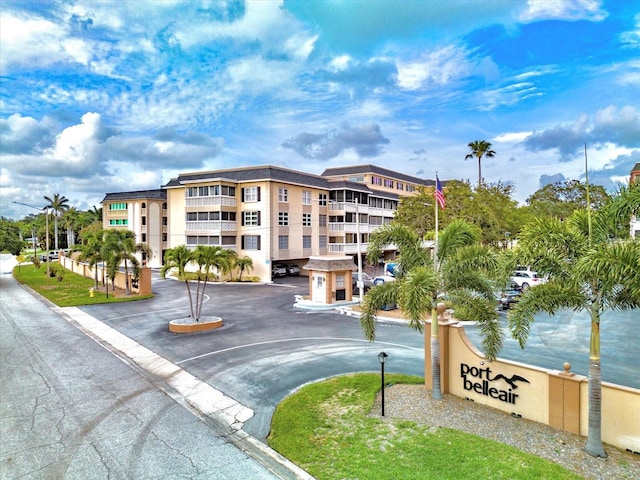 139 Bluff View Dr Unit 405, Belleair Bluffs, FL 33770 - view of apartment building / complex featuring uncovered parking
