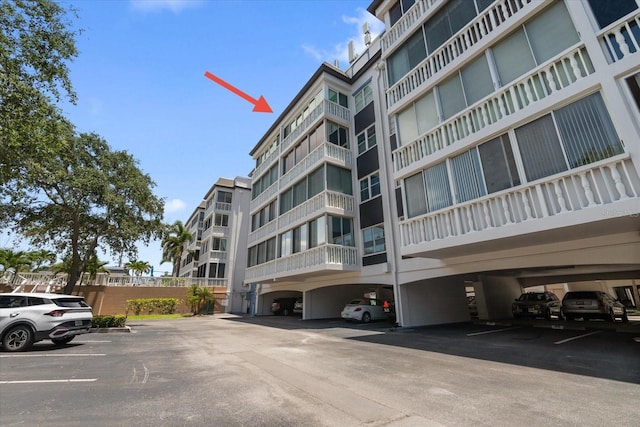 139 Bluff View Dr Unit 405, Belleair Bluffs, FL 33770 - view of apartment building / complex with covered parking