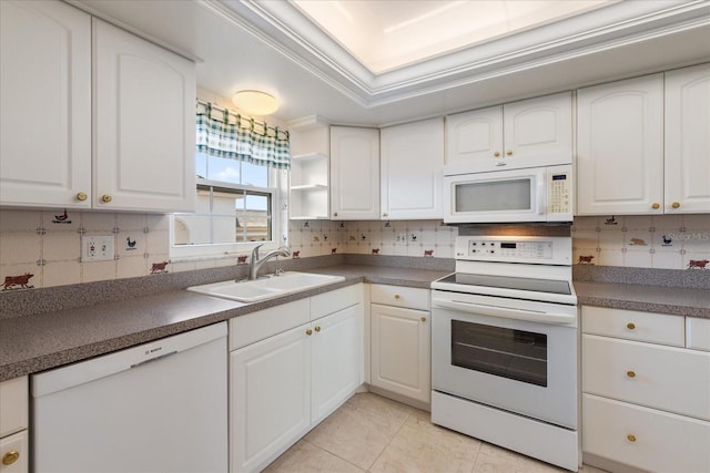 139 Bluff View Dr Unit 405, Belleair Bluffs, FL 33770 - kitchen with white appliances, white cabinetry, backsplash, dark countertops, and light tile patterned flooring
