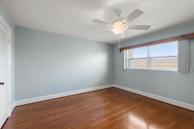 139 Bluff View Dr Unit 405, Belleair Bluffs, FL 33770 - unfurnished room featuring dark wood-style flooring and a ceiling fan