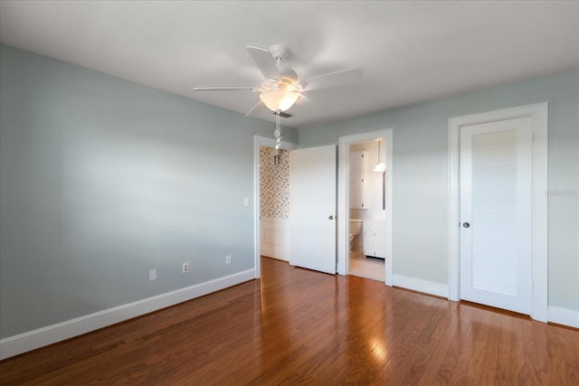 139 Bluff View Dr Unit 405, Belleair Bluffs, FL 33770 - unfurnished bedroom with wood finished floors, ensuite bathroom, and a ceiling fan