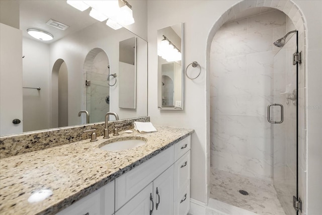 139 Bluff View Dr Unit 405, Belleair Bluffs, FL 33770 - full bathroom with a marble finish shower and vanity