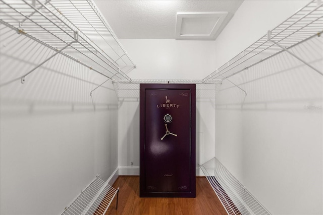 139 Bluff View Dr Unit 405, Belleair Bluffs, FL 33770 - spacious closet with wood finished floors and attic access