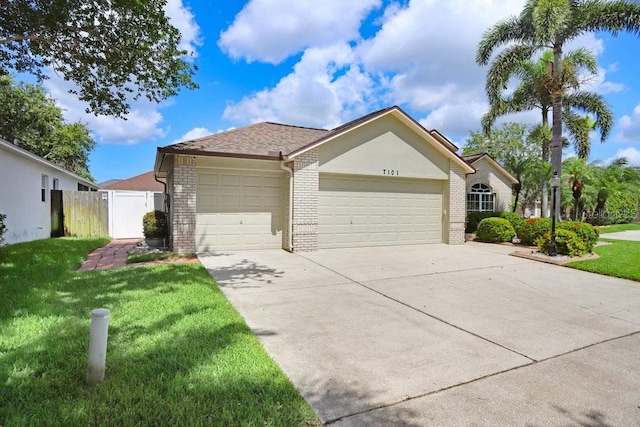 7101 Bucks Ford Dr, Riverview, FL 33578 - single story home featuring a garage, brick siding, and concrete driveway