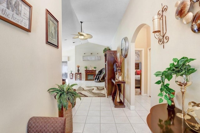 7101 Bucks Ford Dr, Riverview, FL 33578 - hallway featuring arched walkways, vaulted ceiling, and light tile patterned flooring