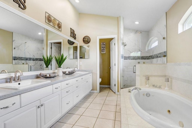 7101 Bucks Ford Dr, Riverview, FL 33578 - full bath featuring double vanity, a tub with jets, a marble finish shower, tile patterned floors, and recessed lighting