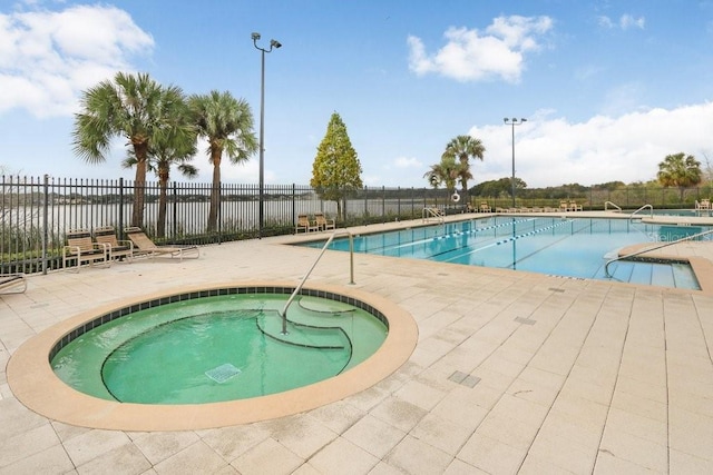 7101 Bucks Ford Dr, Riverview, FL 33578 - community pool with a patio and a hot tub