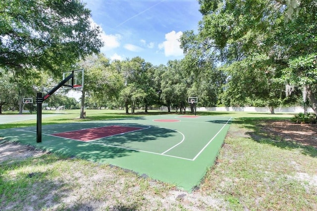 7101 Bucks Ford Dr, Riverview, FL 33578 - view of sport court with community basketball court, a yard, and view of wooded area