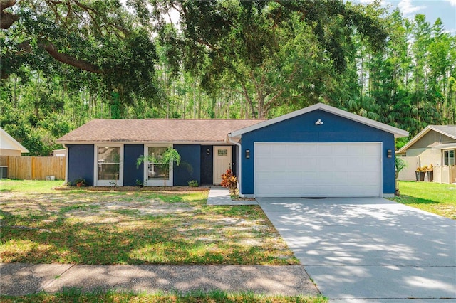 5346 Black Pine Dr, Tampa, FL 33624 - ranch-style home with concrete driveway and an attached garage