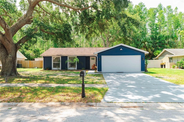 5346 Black Pine Dr, Tampa, FL 33624 - ranch-style house with driveway and a garage