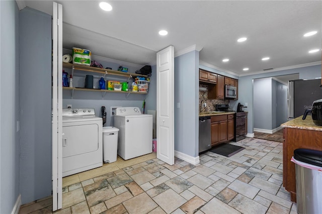 5346 Black Pine Dr, Tampa, FL 33624 - washroom featuring separate washer and dryer, crown molding, and recessed lighting