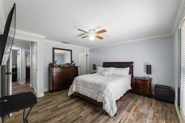 5346 Black Pine Dr, Tampa, FL 33624 - bedroom featuring wood finished floors, crown molding, and ceiling fan