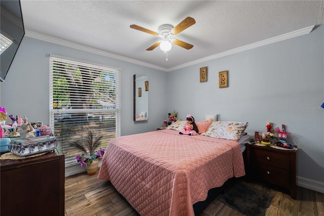 5346 Black Pine Dr, Tampa, FL 33624 - bedroom with ornamental molding, wood-type flooring, a textured ceiling, and a ceiling fan