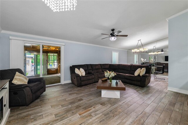 5346 Black Pine Dr, Tampa, FL 33624 - living area with a chandelier, ceiling fan, crown molding, and wood finished floors